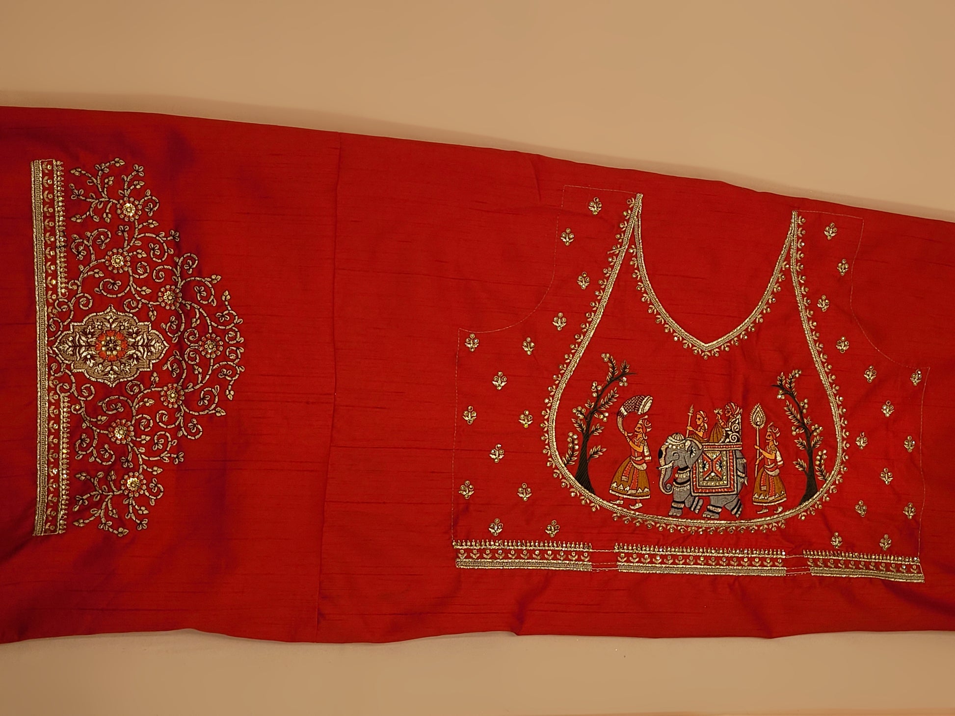 Lehenga:&nbsp;Crafted from luxurious silk, this red bridal lehenga is adorned with intricate multicolor embroidery using Resham, Zari, and Zarkan techniques. The heavy embroidery showcases the rich heritage of Indian craftsmanship, making it a perfect choice for brides.
Blouse:&nbsp;The set comes with a heavily embroidered unstitched blouse, allowing you to tailor it to your perfect fit. Please note, the blouse worn by the model is for reference purposes only.