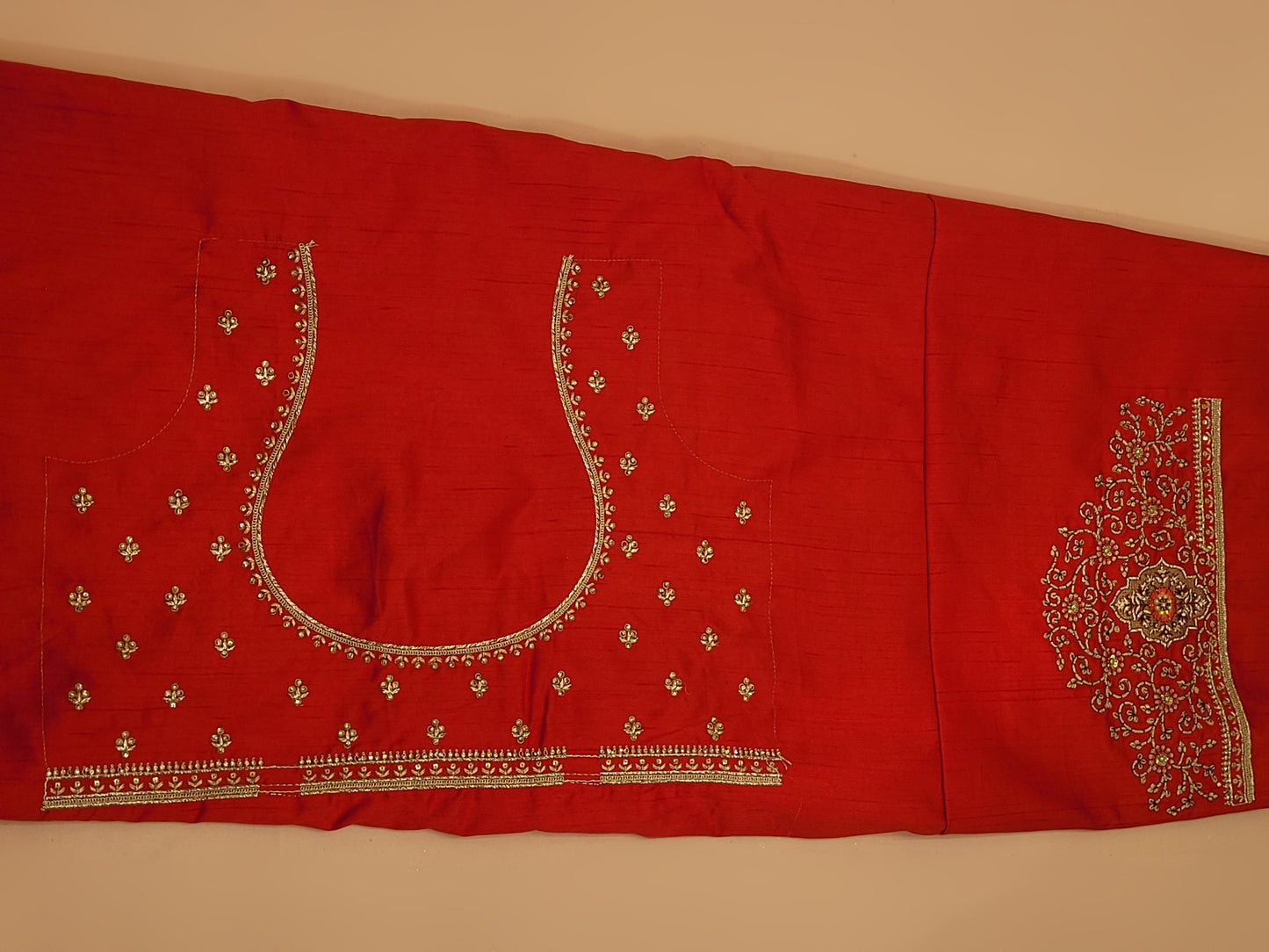 Lehenga:&nbsp;Crafted from luxurious silk, this red bridal lehenga is adorned with intricate multicolor embroidery using Resham, Zari, and Zarkan techniques. The heavy embroidery showcases the rich heritage of Indian craftsmanship, making it a perfect choice for brides.
Blouse:&nbsp;The set comes with a heavily embroidered unstitched blouse, allowing you to tailor it to your perfect fit. Please note, the blouse worn by the model is for reference purposes only.