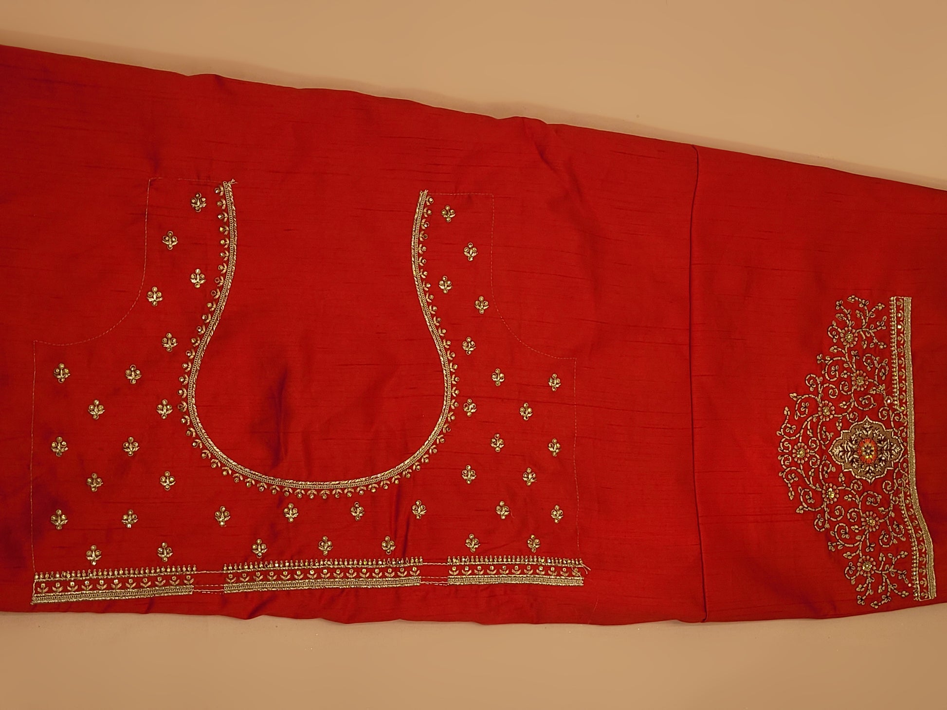 Lehenga:&nbsp;Crafted from luxurious silk, this red bridal lehenga is adorned with intricate multicolor embroidery using Resham, Zari, and Zarkan techniques. The heavy embroidery showcases the rich heritage of Indian craftsmanship, making it a perfect choice for brides.
Blouse:&nbsp;The set comes with a heavily embroidered unstitched blouse, allowing you to tailor it to your perfect fit. Please note, the blouse worn by the model is for reference purposes only.